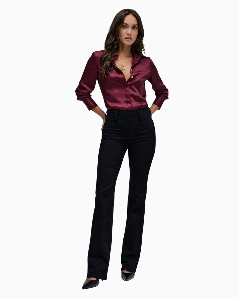 Model wearing Salsa black Push In bootcut jeans styled with heels