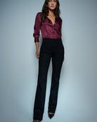Front view of Salsa black bootcut jeans with side zip and faux front pockets
