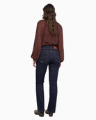 Salsa Jeans Secret Bootcut Perfect Shape Jeans in Dark Denim, back view on model showing rear pockets and leg shape.