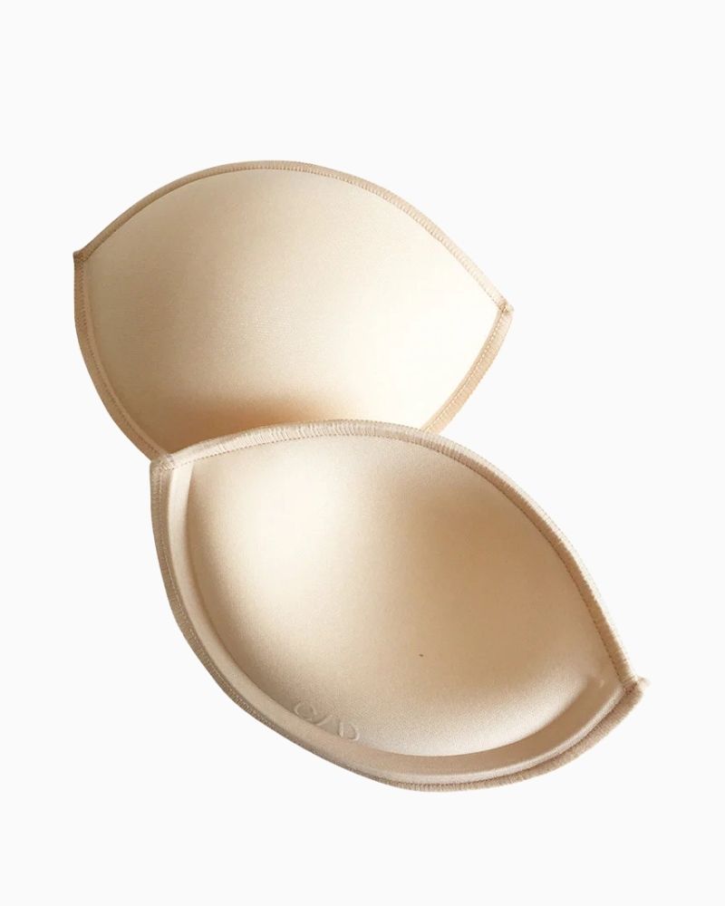 Back view of contoured bra inserts showing soft-shell finish
