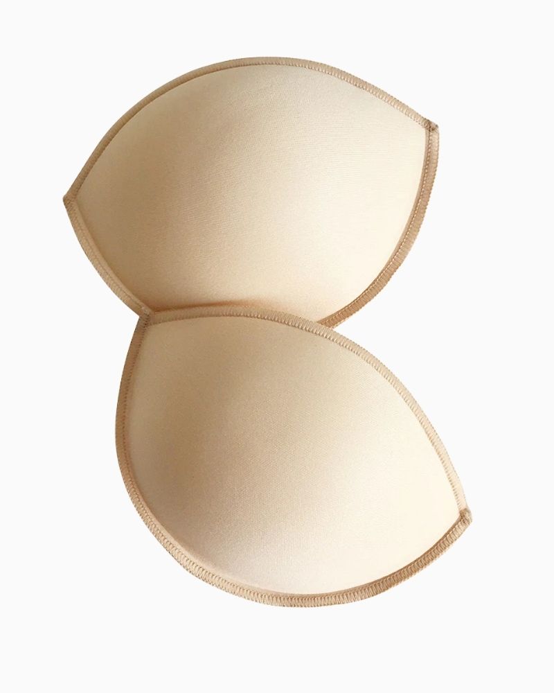 Front view of contoured bra inserts showing soft-shell finish