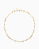Gold plated hearts tennis necklace shown with linen drawstring pouch
