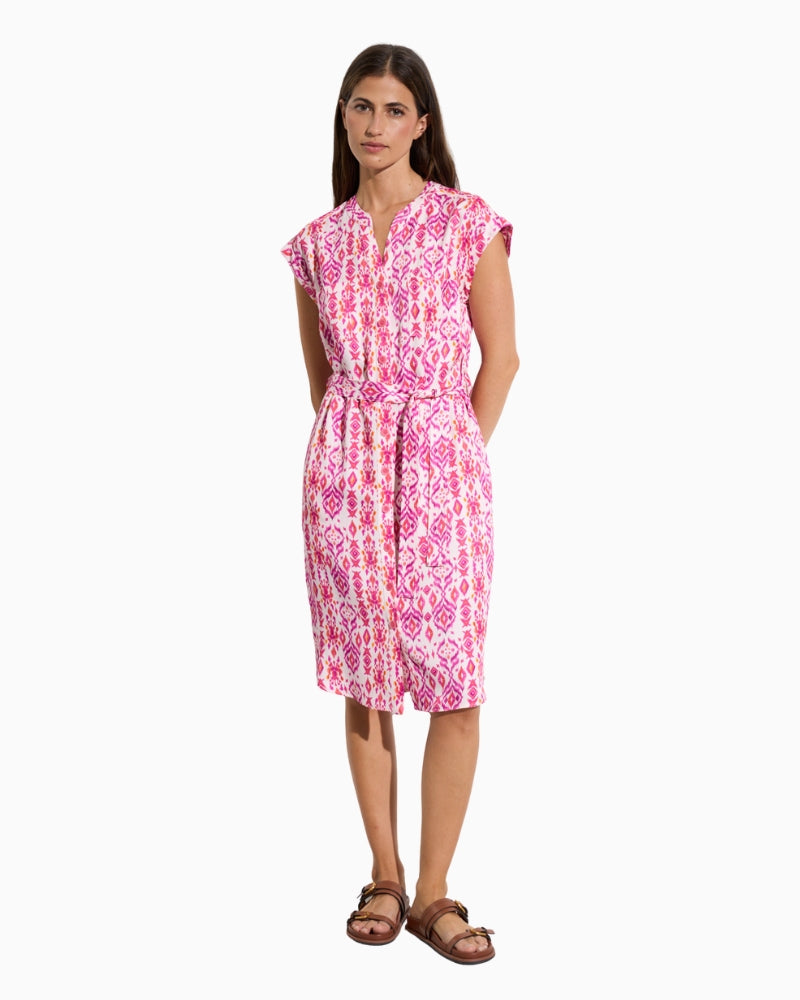 Woman wearing Tina Leya shirt dress in fuchsia, front view – Áines Boutique