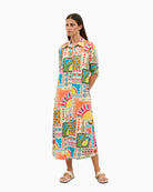 Woman wearing Tinta Begona turquoise shirt dress front view – Áines Boutique