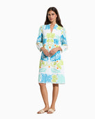 Woman wearing Tinta Cedro long sleeve turquoise dress front view – Áines Boutique