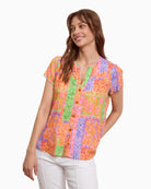 Tinta Evia orange short sleeve blouse, front view on model – Áines Boutique