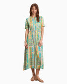 Woman wearing Tinta Santorini maxi dress in turquoise, front view – Áines Boutique