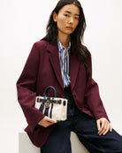 Woman wearing Tommy Hilfiger American Icon micro tote canvas – Áines Boutique