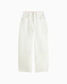 Detail of waistband, zip closure, and structured denim fabric