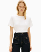 Woman wearing Tommy Hilfiger white boxy interlock tee front view – Áines Boutique
