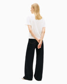 Back of Tommy Hilfiger boxy tee styled with dark denim – Áines Boutique