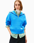 Front view of Tommy Hilfiger cable knit half-zip sweater in cream