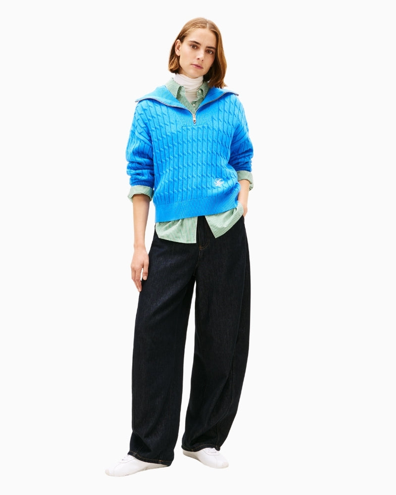 Model styling cable knit half-zip with jeans and boots