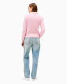 Back view of baby pink jumper with rib-knit hem