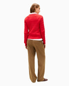 Back view of classic red cotton jumper with rib-knit cuffs