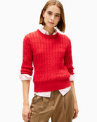 Front view of red Tommy Hilfiger cable knit jumper with crew neck