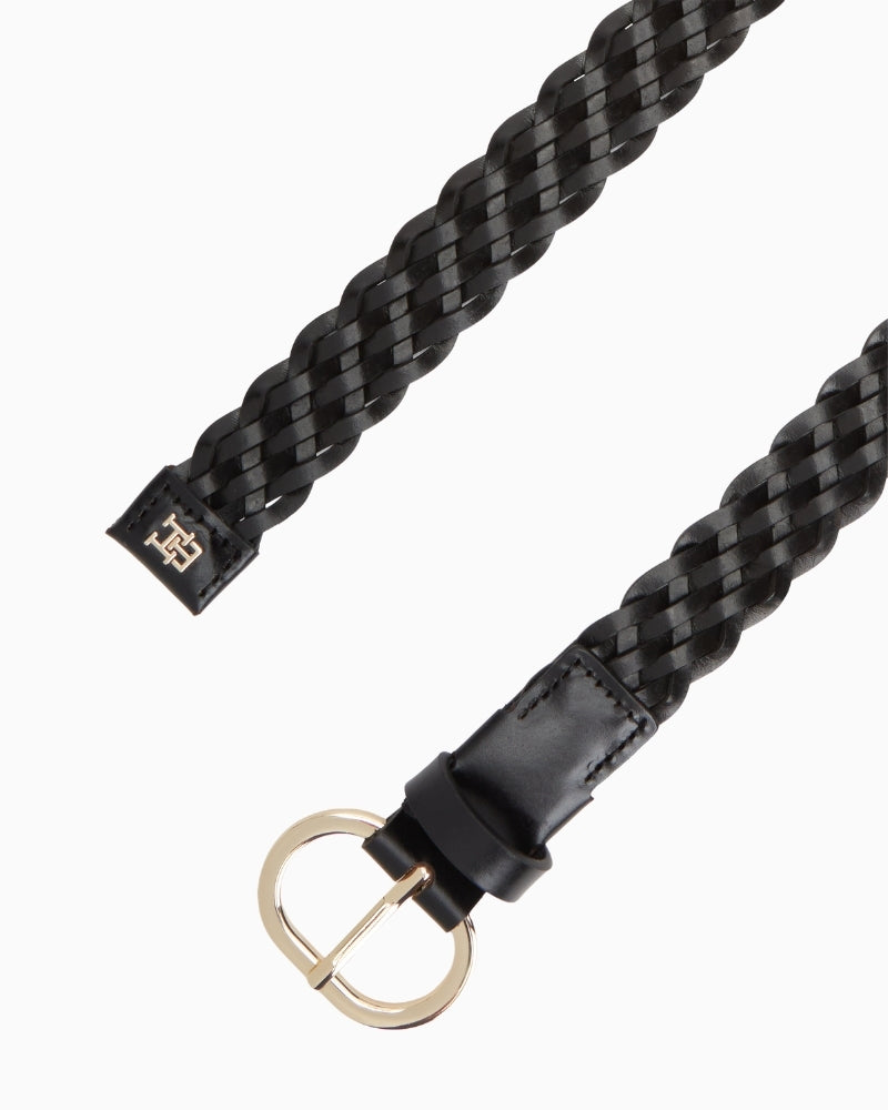 Close-up of textured leather weave and metal buckle