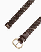 Close-up of woven leather texture and metal buckle
