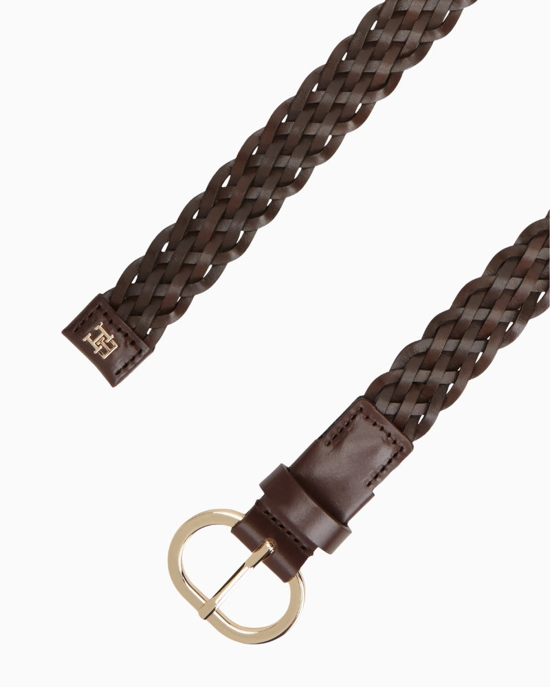 Close-up of woven leather texture and metal buckle