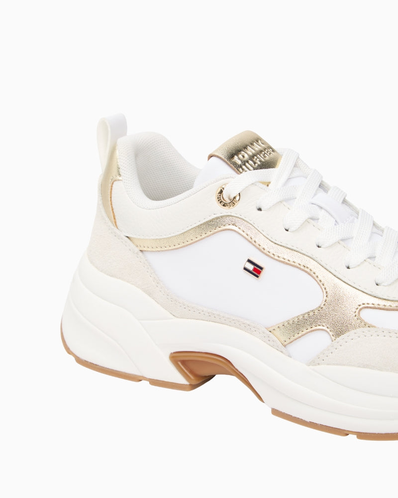 Close-up of cow nappa leather and gold accents