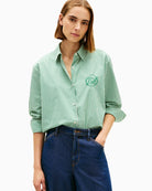 Front view of green cotton long sleeve shirt by Tommy Hilfiger
