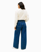 Back view of full-length cotton denim jeans with pocket detail