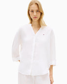 Woman wearing Tommy Hilfiger linen collarless shirt white front view – Áines Boutique