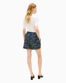 Woman wearing Tommy Hilfiger linen pull-on shorts navy print back view – Áines Boutique