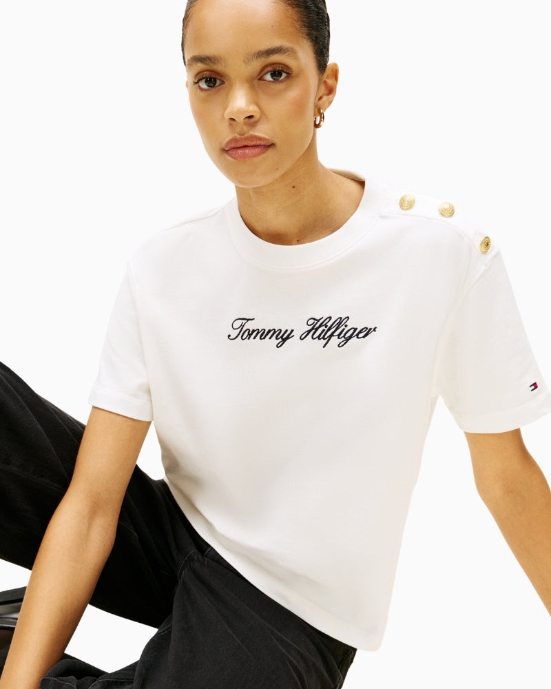 Close-up of embroidered Tommy Hilfiger script logo on chest
