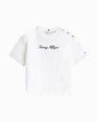 Detail of gold-tone buttons with TH crest on shoulder