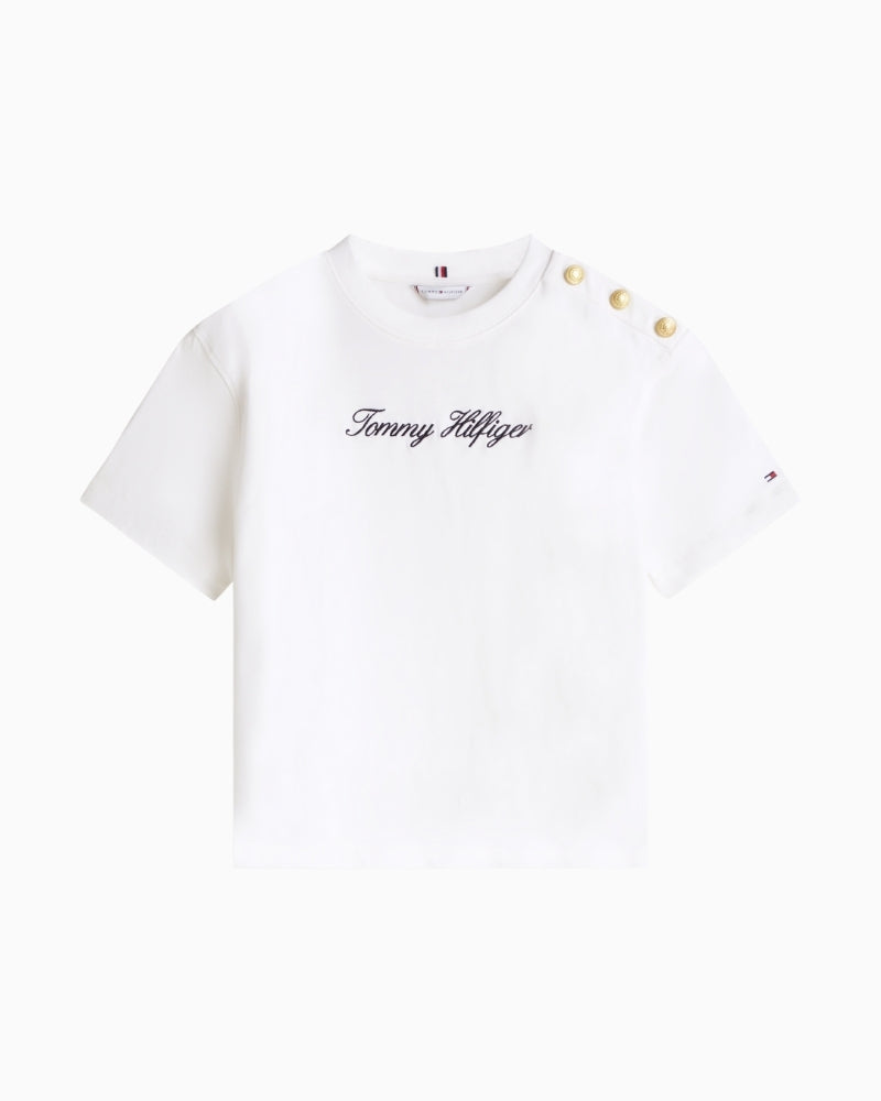 Detail of gold-tone buttons with TH crest on shoulder