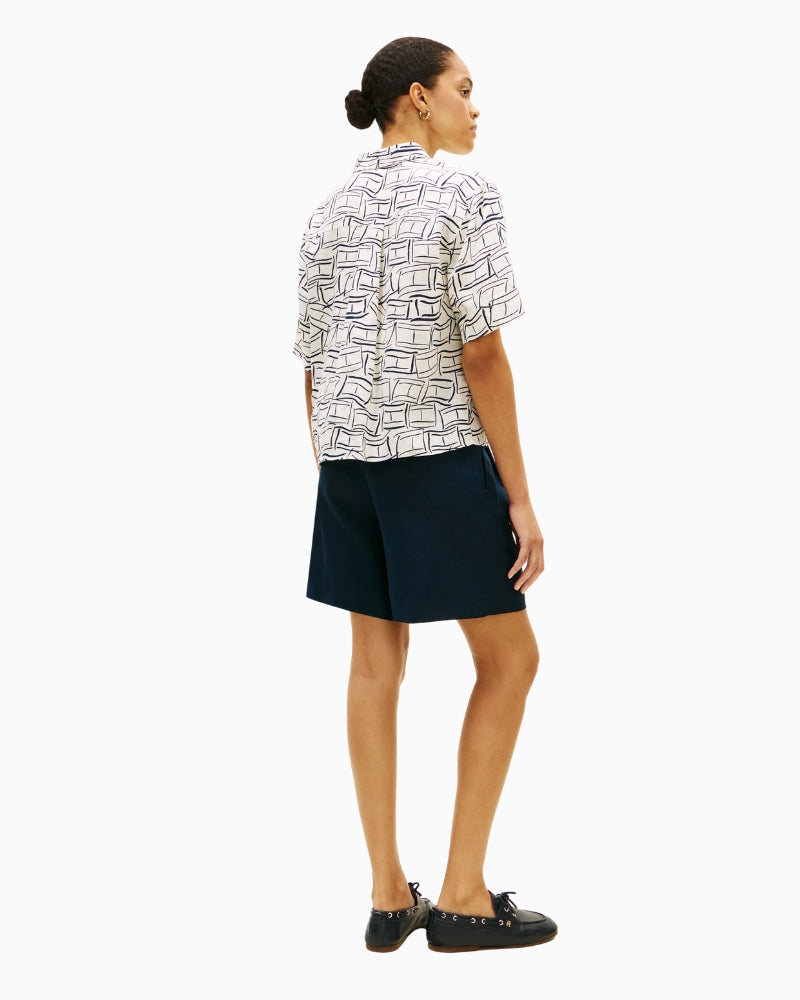 Short sleeve linen shirt styled with navy trousers – Áines Boutique