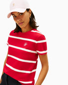 Close-up of embroidered script logo on soft cotton jersey fabric