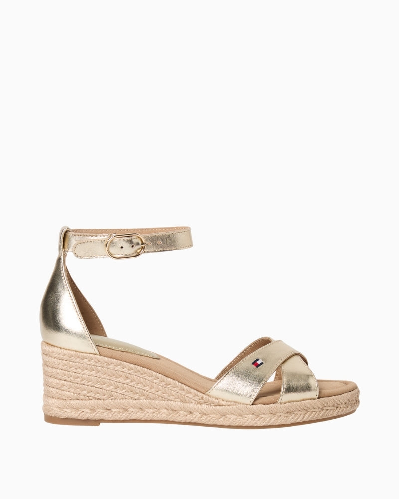 Gold Tommy Hilfiger mid wedge espadrille cross sandal angled view on white background – Áines Boutique