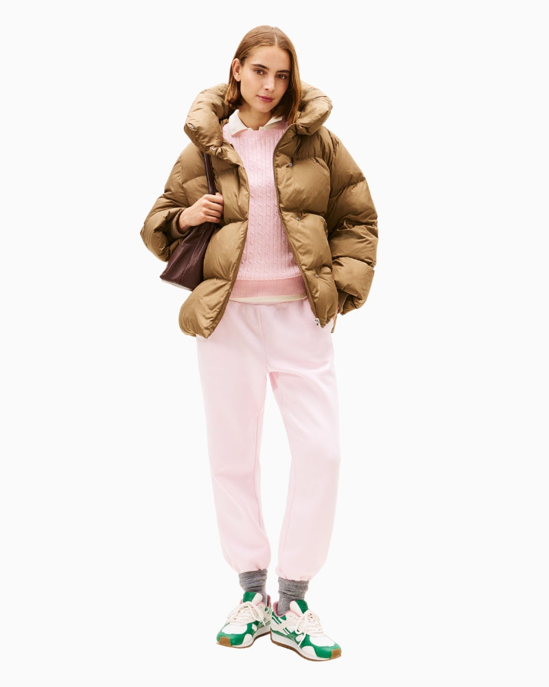 Model wearing pink and green trainers with wide-leg trousers