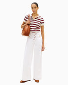 Woman wearing Tommy Hilfiger multistripe modern polo front view – Áines Boutique