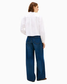 Back view of cropped Tommy Hilfiger oxford shirt on model – Áines Boutique