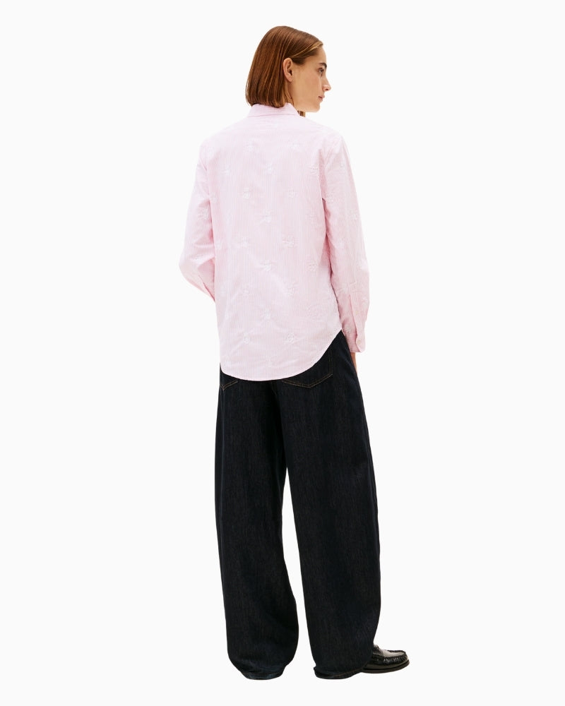 Back view of pink shirt with curved hem and yoke