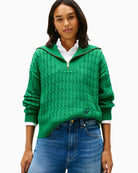 Front view of Tommy Hilfiger green cable knit half-zip jumper