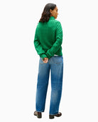 Back view of green cotton jumper with ribbed hem