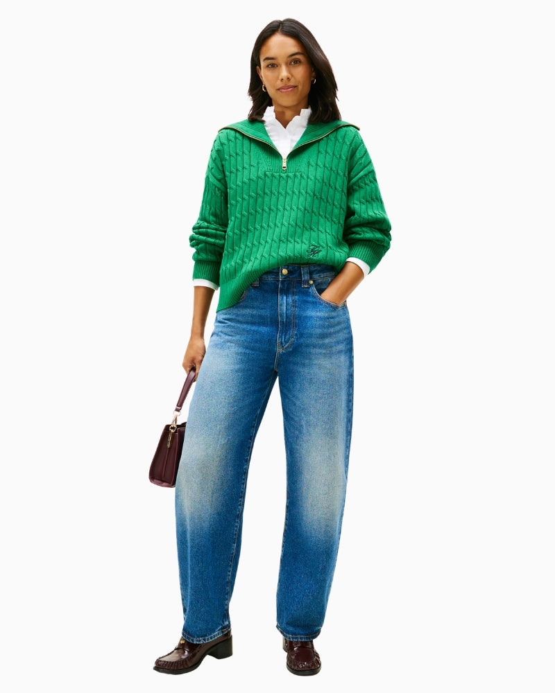 Model styling green half-zip with jeans for casual wear