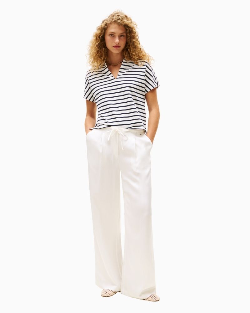 Polo shirt styled casually with trousers for a clean everyday look

