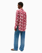 Back view showing dropped shoulders and breathable textured fabric