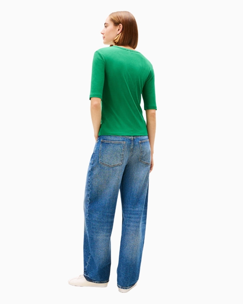 Back view of fitted green top with stretch fabric
