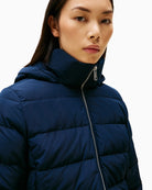 Close-up of detachable faux fur trim on hood of navy down coat