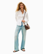 Front of cotton piqué texture with semi-spread collar and button cuffs