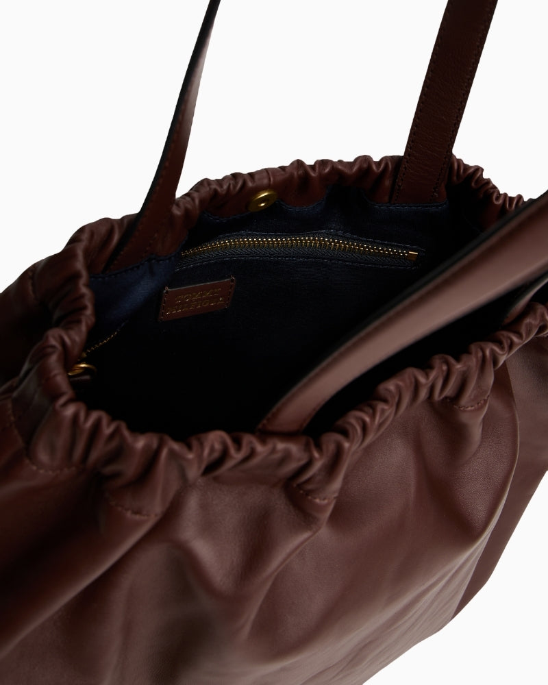 Top-down view of interior compartments of Tommy tote bag