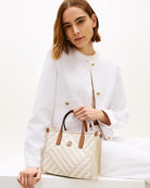 Woman wearing Tommy Hilfiger TH City mini tote – Áines Boutique