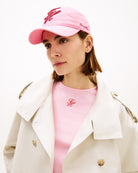 Woman wearing Tommy Hilfiger TH embroidered cap pink – Áines Boutique