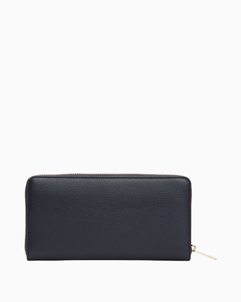 Back view of navy Tommy wallet with zip closure and slim profile